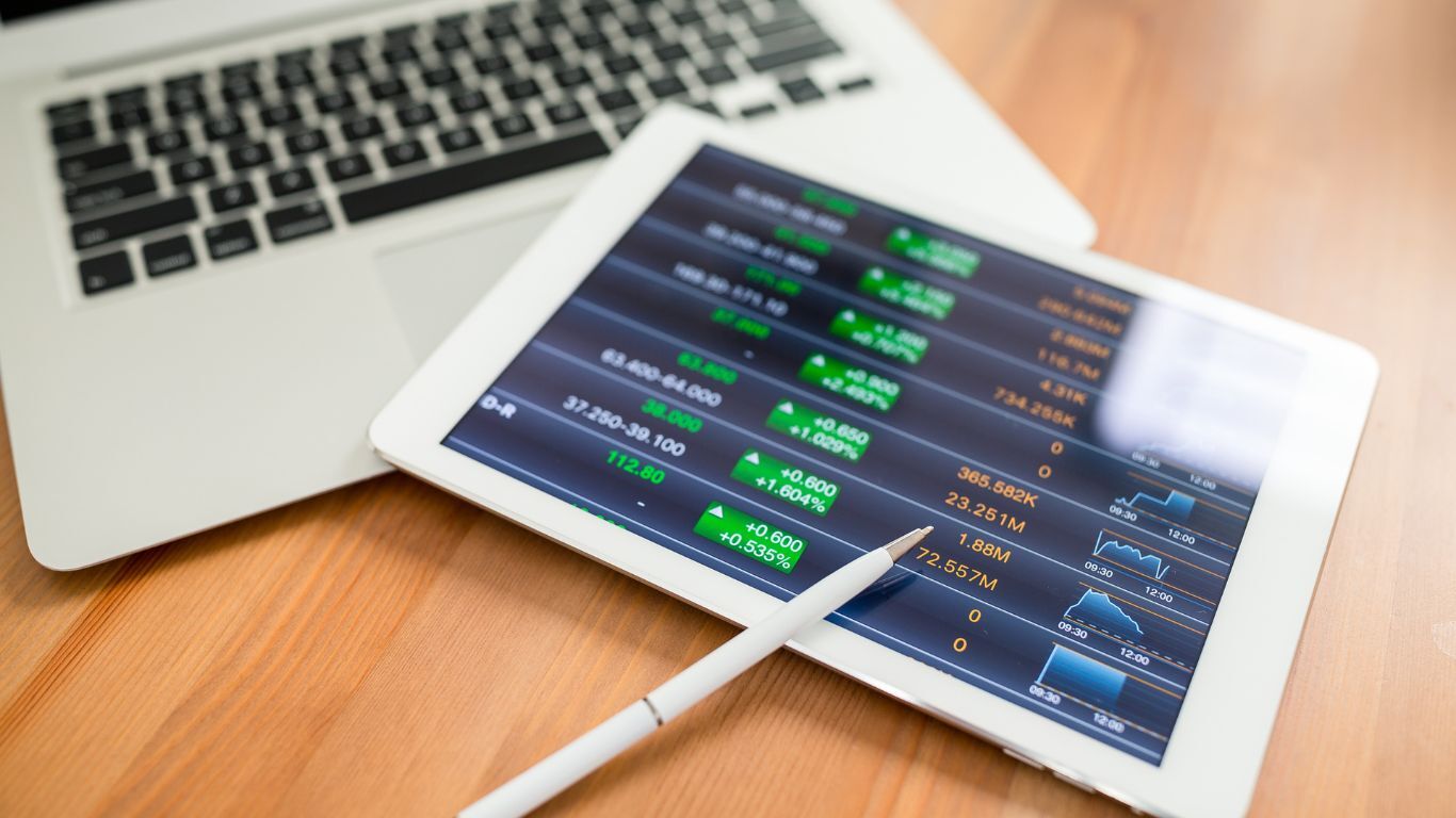 Tablet displaying business data and charts for reporting on contractor performance and growth.