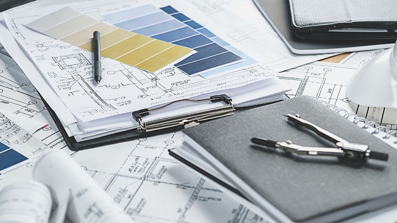Blueprints, color samples and planning tools representing a structured home service sales strategy.
