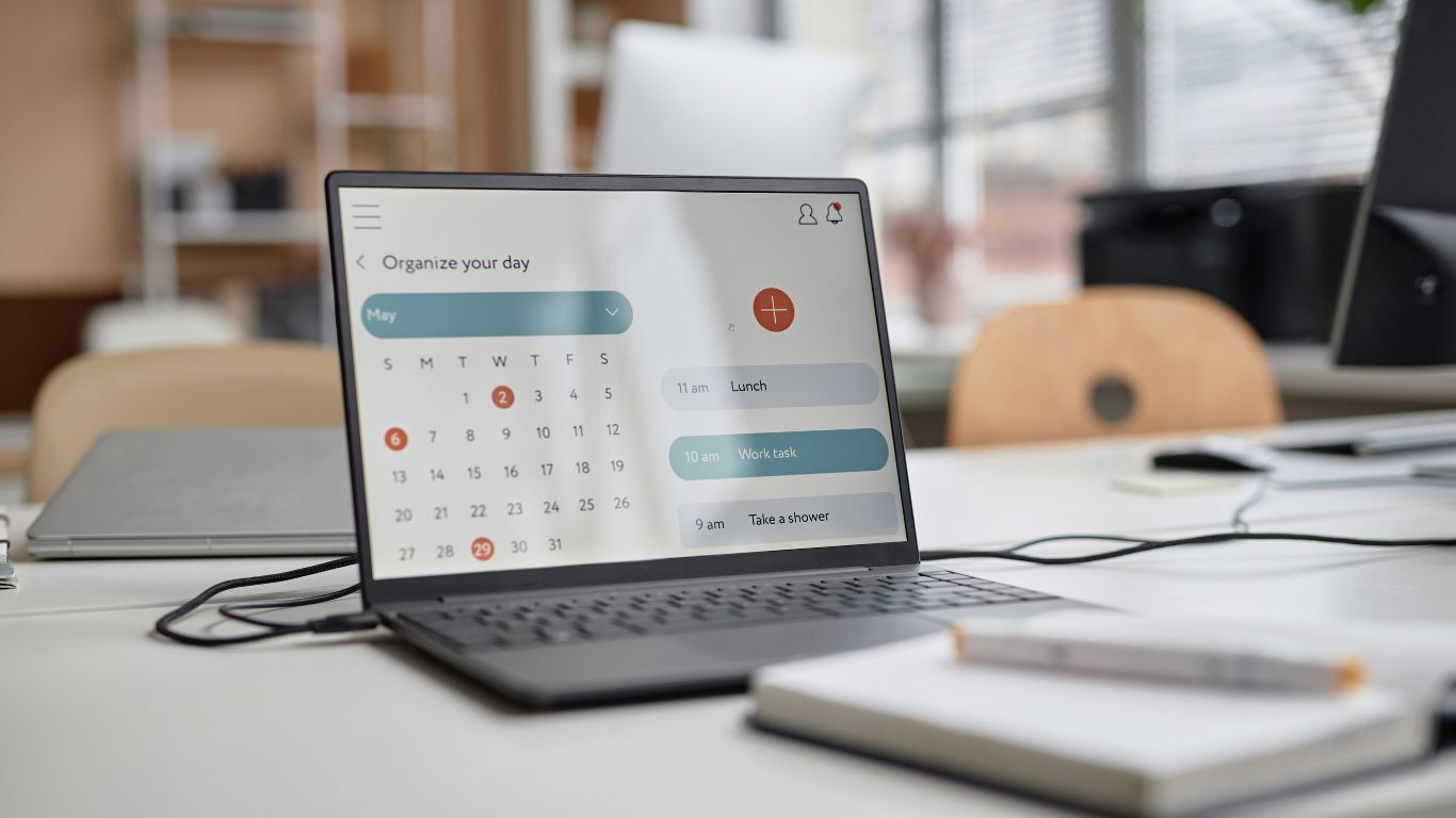 Laptop displaying a contractor calendar dashboard for missed appointments, rescheduling, and schedule changes.