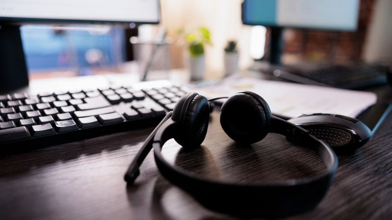 Office workspace with a headset, representing responsive software support and everyday usability for contractor teams.