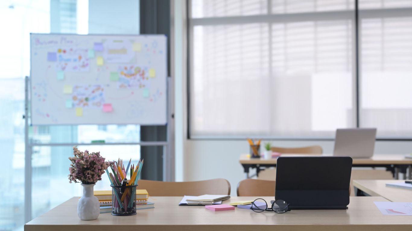 Office workspace with whiteboard and tablet, representing trade business software planning and team collaboration.
