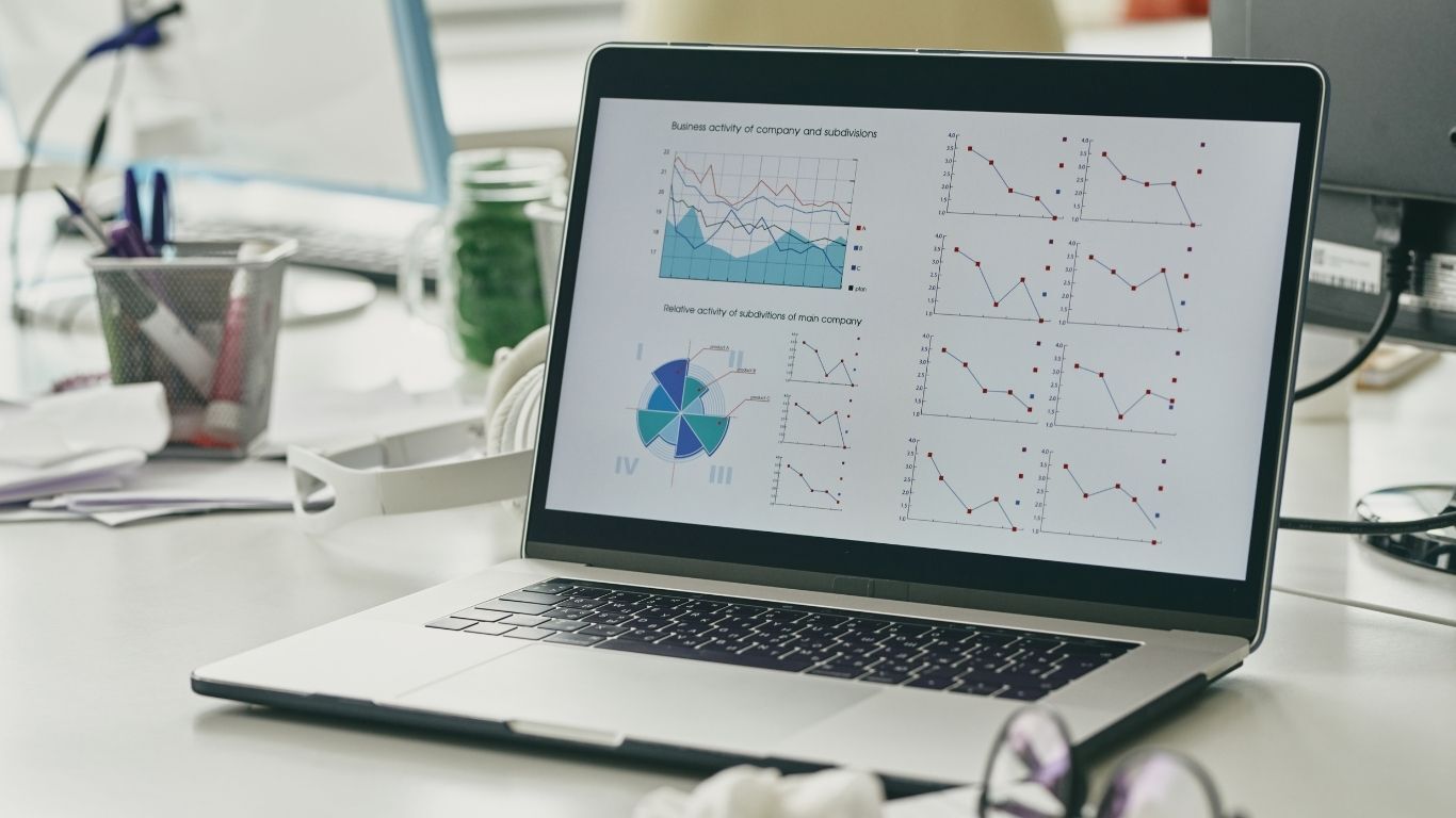 Laptop displaying charts used to track contractor trade show leads, appointments, estimates, and sales.