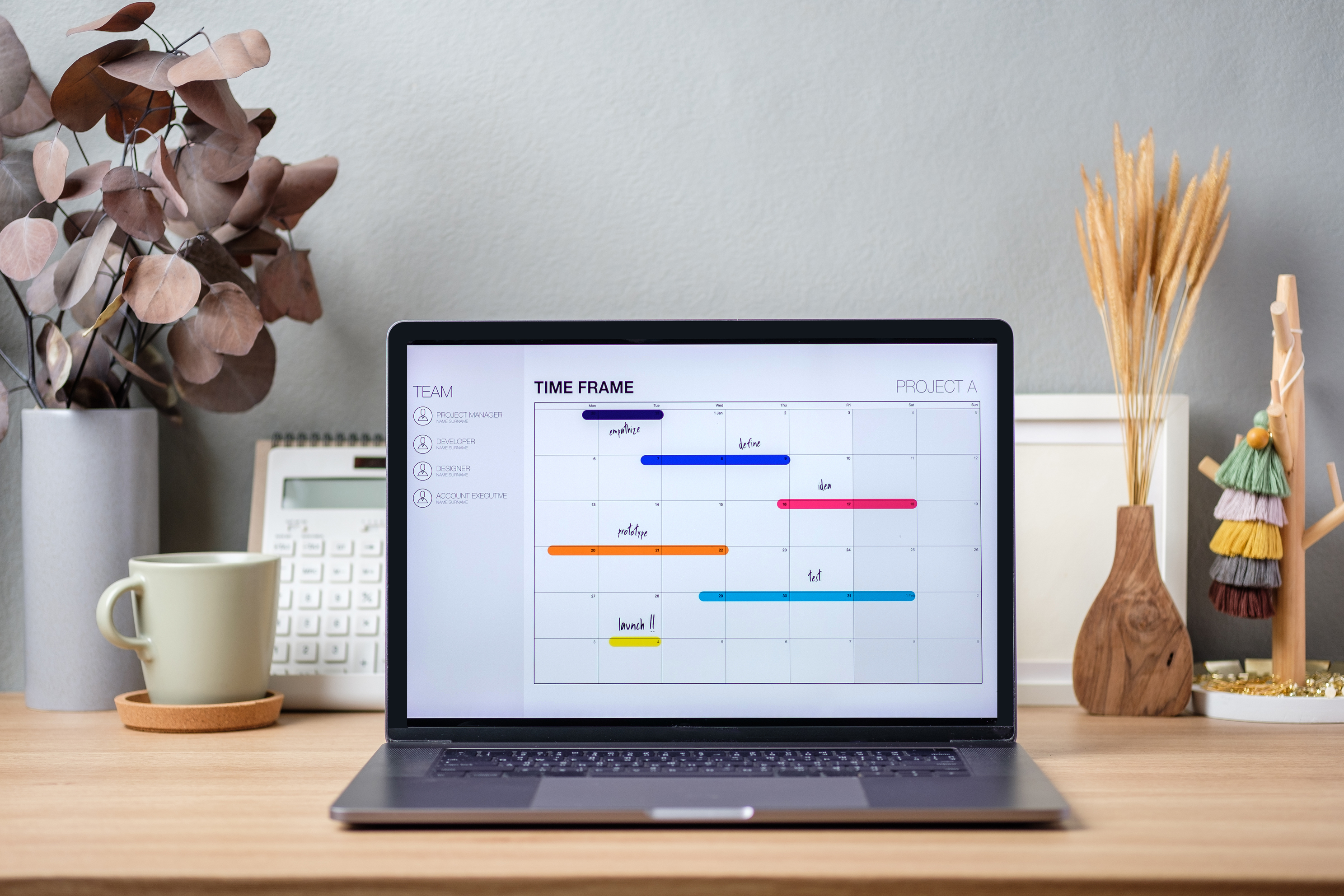 Project Timeline on Laptop Screen in Modern Office