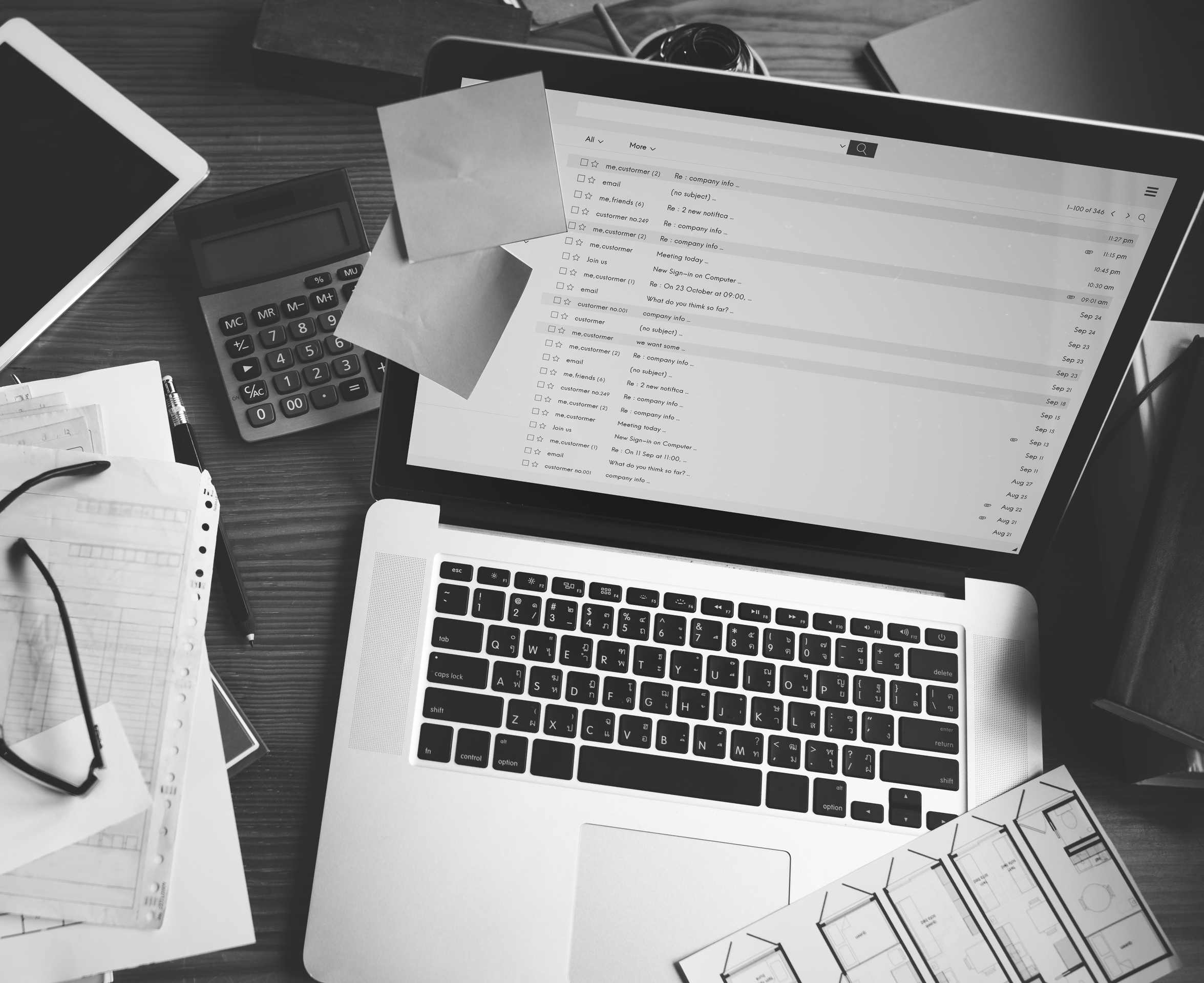 Project wrap-up templates shown beside laptop inbox and plans