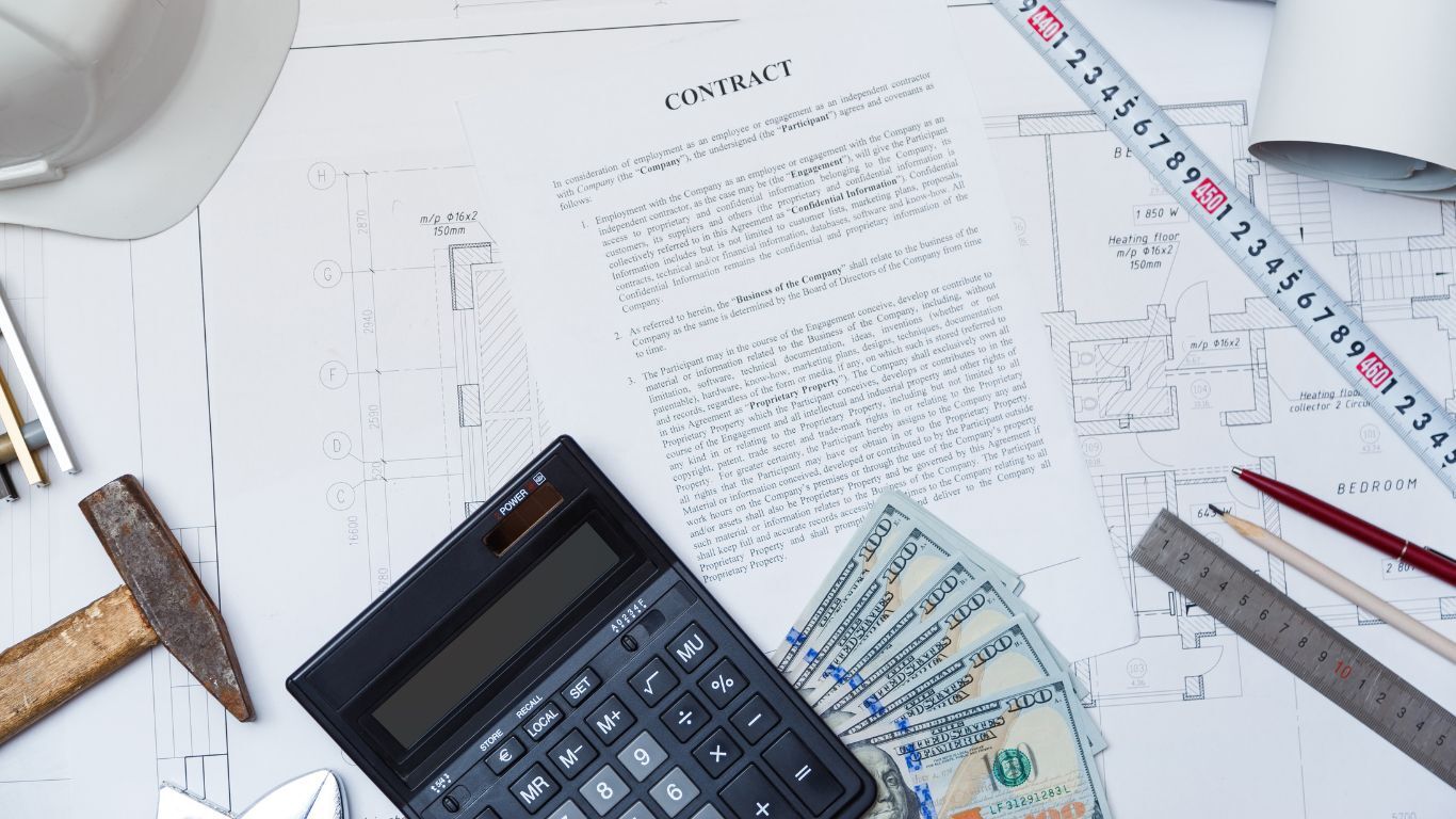 Blueprints, contract, calculator and cash illustrating a construction sales process and project pricing.