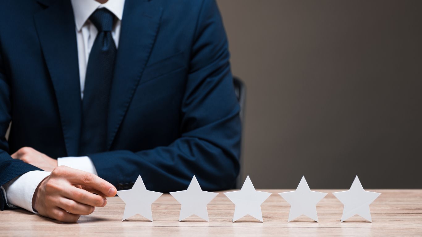 Business professional reviewing five-star feedback as contractor social proof from satisfied customers.