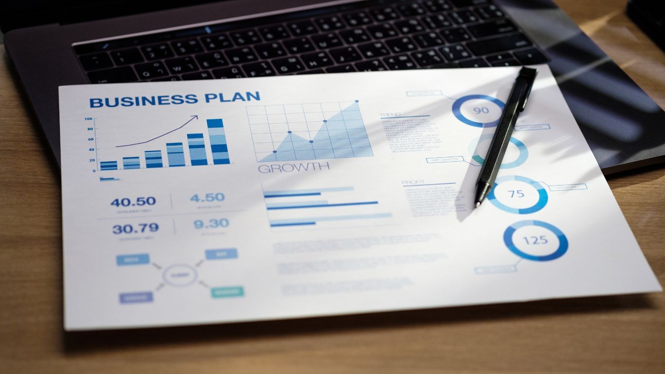 Business plan and growth charts supporting a practical year-end business strategy for contractors.