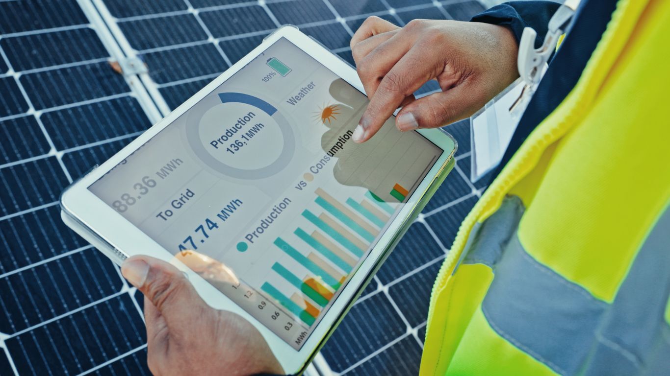Contractor reporting dashboard showing solar production and performance data on a tablet during field analysis.