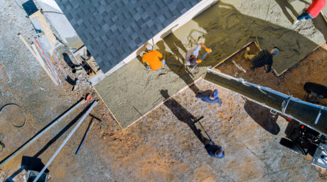 A concrete mixing truck pours concrete onto the bu 2026 01 09 08 09 12 utc