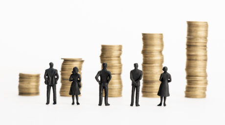 Group of figurines looking at growing stacks of co 2026 01 08 06 00 06 utc