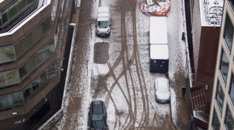 Looking down on snowy city streets of london cars 2026 01 05 23 25 56 utc